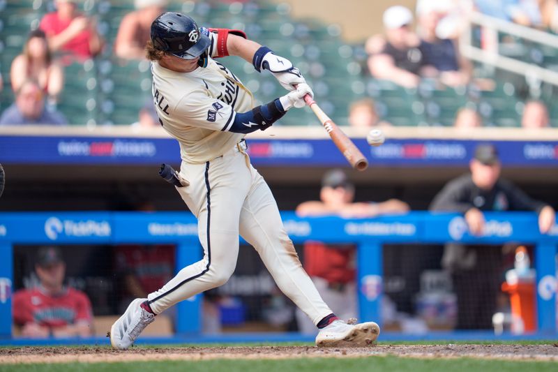 Sep 14, 2025; Minneapolis, Minnesota, USA; Minnesota Twins second base Luke Keaschall (15) singles off Arizona Diamondbacks pitcher Anthony DeSclafani (21) in the eighth inning at Target Field. Mandatory Credit: Matt Blewett-Imagn Images