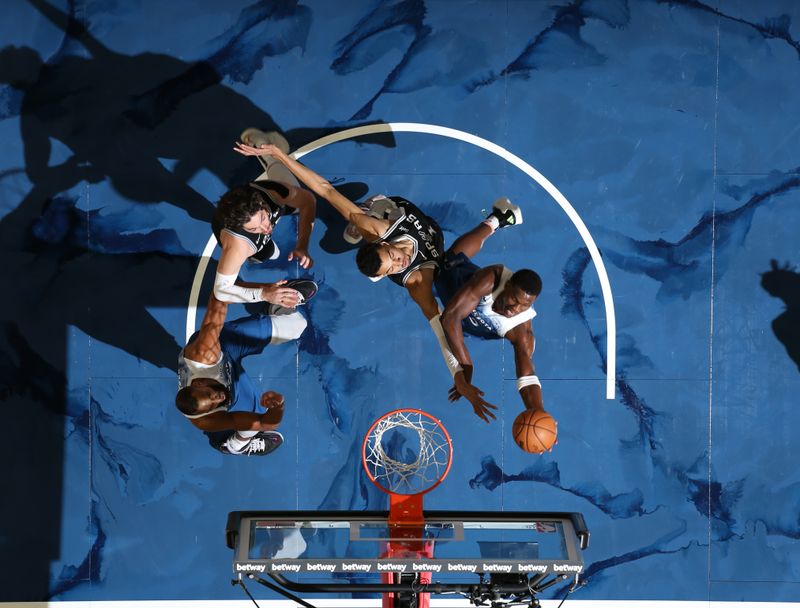 MINNEAPOLIS, MN -  FEBRUARY 27: Anthony Edwards #5 of the Minnesota Timberwolves drives to the basket during the game against the San Antonio Spurs on February 27, 2024 at Target Center in Minneapolis, Minnesota. NOTE TO USER: User expressly acknowledges and agrees that, by downloading and or using this Photograph, user is consenting to the terms and conditions of the Getty Images License Agreement. Mandatory Copyright Notice: Copyright 2024 NBAE (Photo by David Sherman/NBAE via Getty Images)