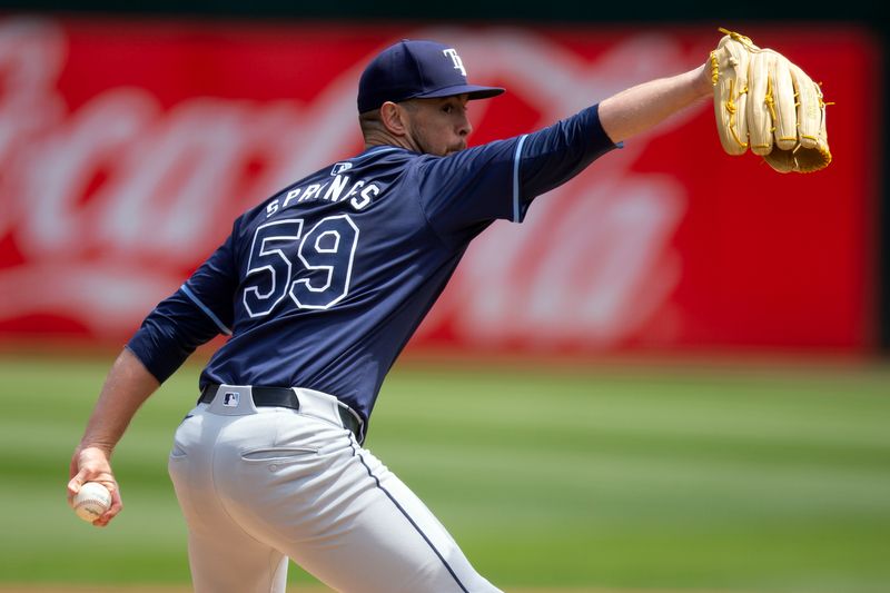 Aug 22, 2024; Oakland, California, USA; Tampa Bay Rays starting pitcher Jeffrey Springs (59) delivers a pitch against the Oakland Athletics during the first inning at Oakland-Alameda County Coliseum. Mandatory Credit: D. Ross Cameron-USA TODAY Sports