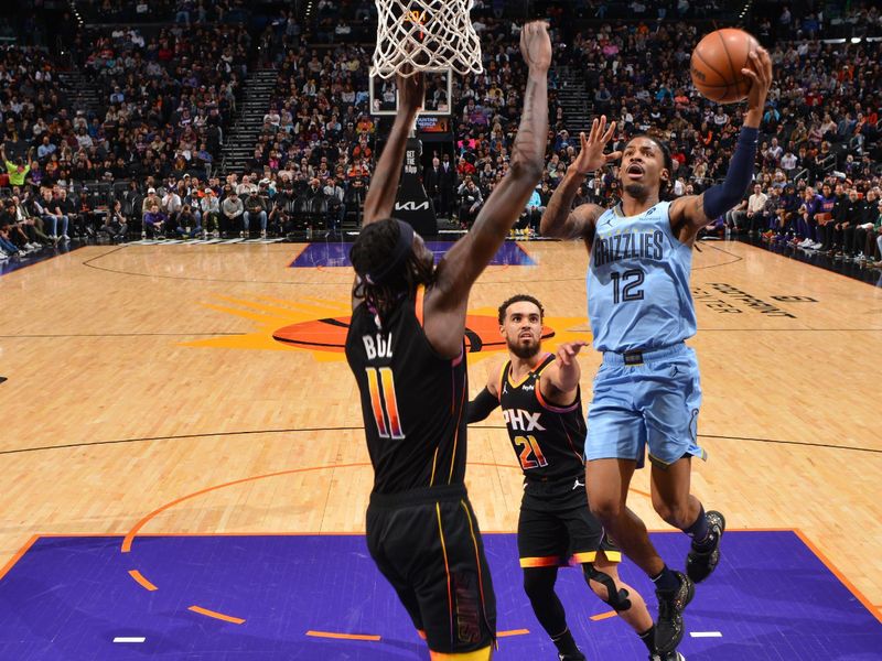 PHOENIX, AZ - FEBRUARY 11:  Ja Morant #12 of the Memphis Grizzlies shoots the ball during the game on February 11, 2025 at Footprint Center in Phoenix, Arizona. NOTE TO USER: User expressly acknowledges and agrees that, by downloading and or using this photograph, user is consenting to the terms and conditions of the Getty Images License Agreement. Mandatory Copyright Notice: Copyright 2025 NBAE (Photo by Barry Gossage/NBAE via Getty Images)