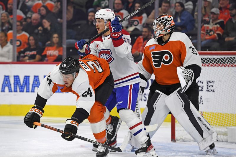 Oct 27, 2024; Philadelphia, Pennsylvania, USA; Montreal Canadiens left wing Michael Pezzetta (55) and Philadelphia Flyers defenseman Nick Seeler (24) battle for position inn front of goaltender Aleksei Kosolov (35) during the first period at Wells Fargo Center. Mandatory Credit: Eric Hartline-Imagn Images