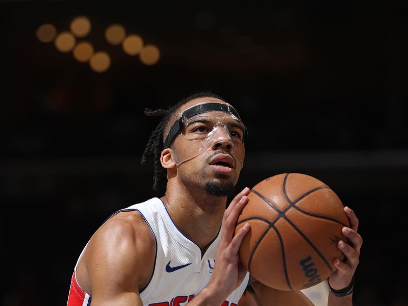 MEMPHIS, TN - APRIL 5: Tosan Evbuomwan #18 of the Detroit Pistons shoots a free throw during the game against the Memphis Grizzlies on April 5, 2024 at FedExForum in Memphis, Tennessee. NOTE TO USER: User expressly acknowledges and agrees that, by downloading and or using this photograph, User is consenting to the terms and conditions of the Getty Images License Agreement. Mandatory Copyright Notice: Copyright 2024 NBAE (Photo by Joe Murphy/NBAE via Getty Images)