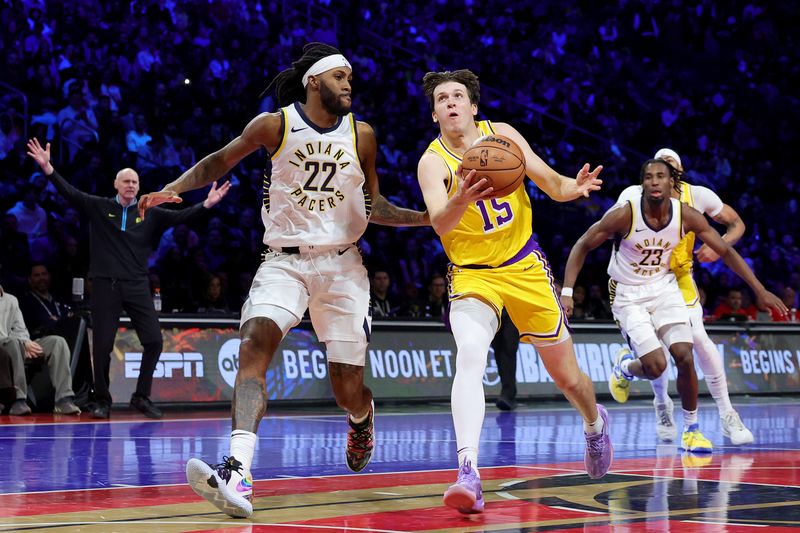 LAS VEGAS, NEVADA - DECEMBER 09: Austin Reaves #15 of the Los Angeles Lakers drives to the basket against Isaiah Jackson #22 of the Indiana Pacers during the second quarter in the championship game of the inaugural NBA In-Season Tournament at T-Mobile Arena on December 09, 2023 in Las Vegas, Nevada. NOTE TO USER: User expressly acknowledges and agrees that, by downloading and or using this photograph, User is consenting to the terms and conditions of the Getty Images License Agreement. (Photo by Ethan Miller/Getty Images)