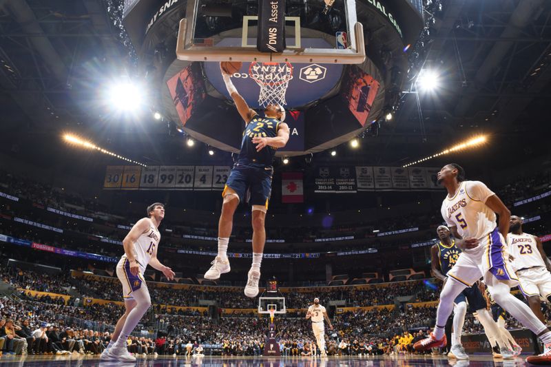 LOS ANGELES, CA - MARCH 24: Andrew Nembhard #2 of the Indiana Pacers drives to the basket during the game against the Los Angeles Lakers on March 24, 2024 at Crypto.Com Arena in Los Angeles, California. NOTE TO USER: User expressly acknowledges and agrees that, by downloading and/or using this Photograph, user is consenting to the terms and conditions of the Getty Images License Agreement. Mandatory Copyright Notice: Copyright 2024 NBAE (Photo by Garrett Ellwood/NBAE via Getty Images)