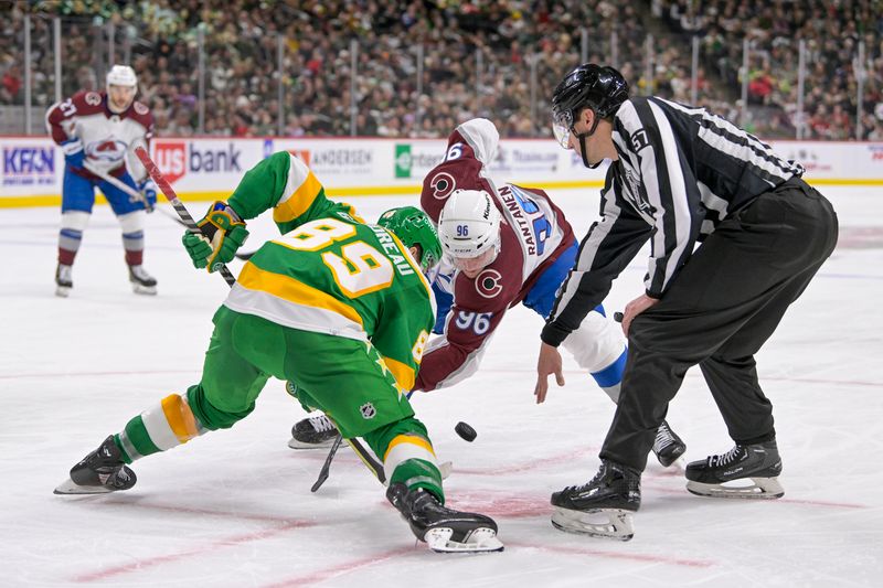 Nov 24, 2023; Saint Paul, Minnesota, USA; Minnesota Wild forward Frederick Gaudreau (89) and Colorado Avalanche forward Mikko Rantanen (96) face-off during the third period at Xcel Energy Center. Mandatory Credit: Nick Wosika-USA TODAY Sports