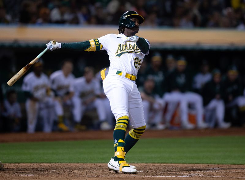 Sep 15, 2023; Oakland, California, USA; Oakland Athletics center fielder Lawrence Butler (22) swings and misses for strike three against the San Diego Padres during the seventh inning at Oakland-Alameda County Coliseum. Mandatory Credit: D. Ross Cameron-USA TODAY Sports