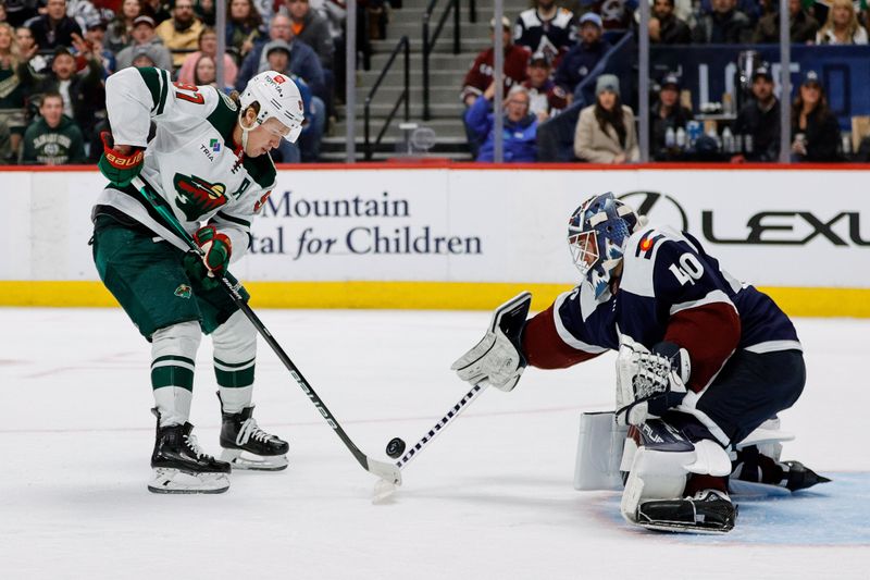 Mar 8, 2024; Denver, Colorado, USA; Minnesota Wild left wing Kirill Kaprizov (97) attempts a shot against Colorado Avalanche goaltender Alexandar Georgiev (40) in the third period at Ball Arena. Mandatory Credit: Isaiah J. Downing-USA TODAY Sports