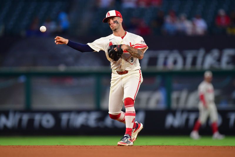 Aug 12, 2024; Anaheim, California, USA; Los Angeles Angels shortstop Zach Neto (9) throws to first for the out against Toronto Blue Jays first baseman Spencer Horwitz (48) during the fifth inning at Angel Stadium. Mandatory Credit: Gary A. Vasquez-USA TODAY Sports