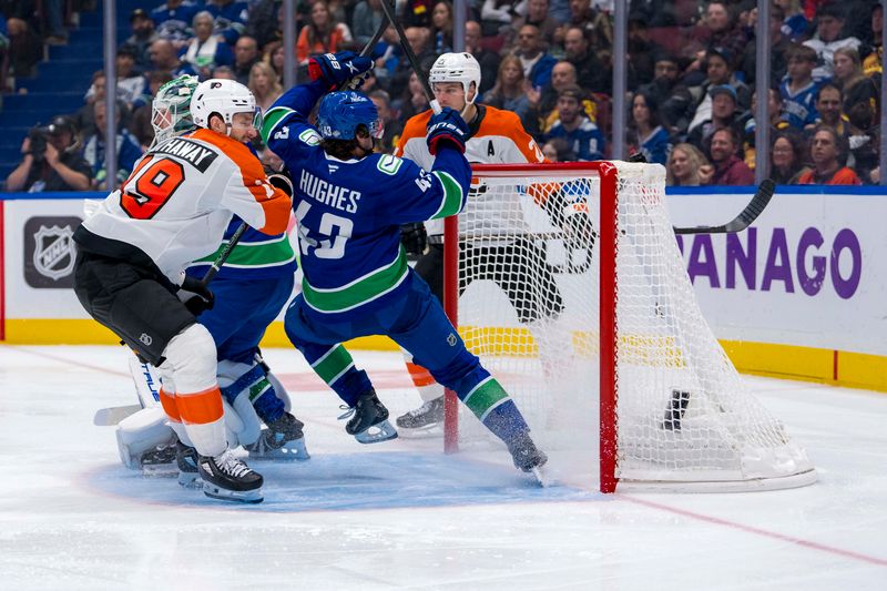 Oct 11, 2024; Vancouver, British Columbia, CAN; Philadelphia Flyers forward Garnet Hathaway (19) checks Vancouver Canucks defenseman Quinn Hughes (43) during the second period at Rogers Arena. Mandatory Credit: Bob Frid-Imagn Images