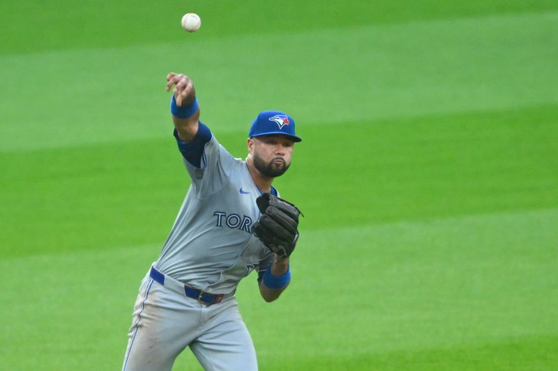 Jun 21, 2024; Cleveland, Ohio, USA; Toronto Blue Jays shortstop Isiah Kiner-Falefa (7) throws to first base in the third inning against the Cleveland Guardians at Progressive Field. Mandatory Credit: David Richard-USA TODAY Sports