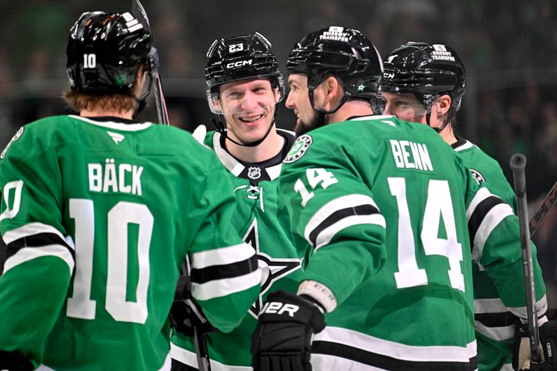 Jan 20, 2026; Dallas, Texas, USA;  Dallas Stars defenseman Esa Lindell (23) and defenseman Miro Heiskanen (4) and center Oskar Back (10) and left wing Jamie Benn (14) celebrates a goal scored by Lindell against the Boston Bruins during the second period at the American Airlines Center. Mandatory Credit: Jerome Miron-Imagn Images