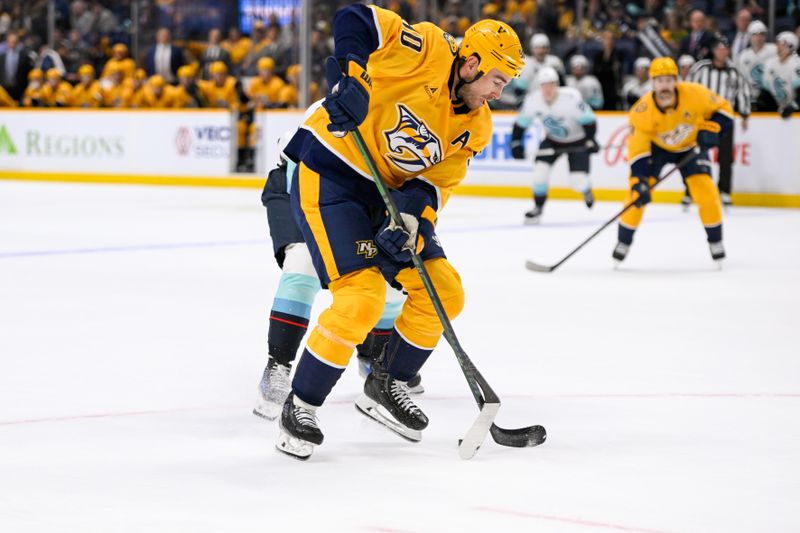 Oct 15, 2024; Nashville, Tennessee, USA;  Nashville Predators center Colton Sissons (10) skates against the Seattle Kraken during the first period at Bridgestone Arena. Mandatory Credit: Steve Roberts-Imagn Images