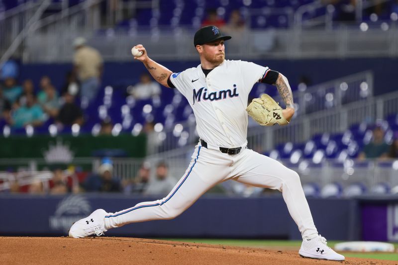 Aug 19, 2024; Miami, Florida, USA; Miami Marlins starting pitcher Adam Oller (77) delivers a pitch against the Arizona Diamondbacks during the first inning at loanDepot Park. Mandatory Credit: Sam Navarro-USA TODAY Sports