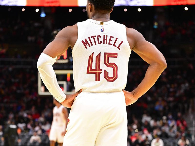 ATLANTA, GA - NOVEMBER 29: Donovan Mitchell #45 of the Cleveland Cavaliers looks on during the game against the Atlanta Hawks during the Emirates NBA Cup game on November 29, 2024 at State Farm Arena in Atlanta, Georgia.  NOTE TO USER: User expressly acknowledges and agrees that, by downloading and/or using this Photograph, user is consenting to the terms and conditions of the Getty Images License Agreement. Mandatory Copyright Notice: Copyright 2024 NBAE (Photo by Adam Hagy/NBAE via Getty Images)