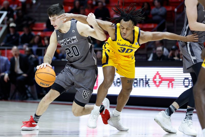 Feb 5, 2023; Salt Lake City, Utah, USA; Utah Utes guard Lazar Stefanovic (20) draws the foul from California Golden Bears guard Wrenn Robinson (30) in the second half at Jon M. Huntsman Center. Mandatory Credit: Jeffrey Swinger-USA TODAY Sports