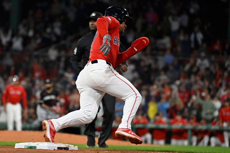 Sep 22, 2024; Boston, MA, USA;  Boston Red Sox second baseman Enmanuel Valdez (47) rounds third base on his way home to score on an RBI by left fielder Jarren Duran (16) during the sixth inning against the Minnesota Twins at Fenway Park. Mandatory Credit: Eric Canha-Imagn Images