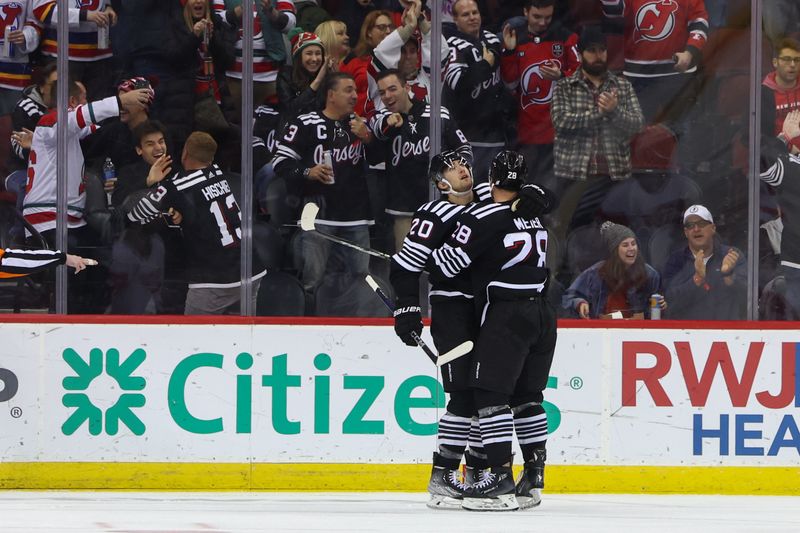 Dec 23, 2023; Newark, New Jersey, USA; New Jersey Devils right wing Timo Meier (28) celebrates his goal against the Detroit Red Wings during the third period at Prudential Center. Mandatory Credit: Ed Mulholland-USA TODAY Sports