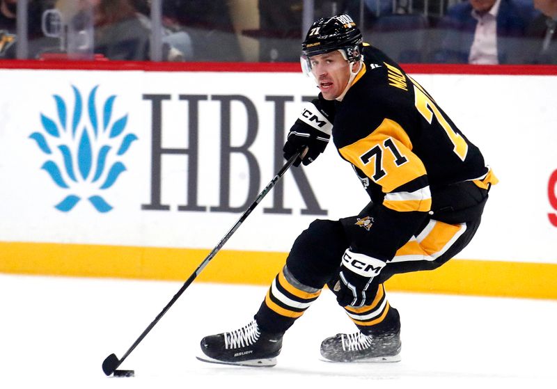 Oct 16, 2024; Pittsburgh, Pennsylvania, USA;  Pittsburgh Penguins center Evgeni Malkin (71) skates with the puck against the Buffalo Sabres during the first period at PPG Paints Arena. Mandatory Credit: Charles LeClaire-Imagn Images