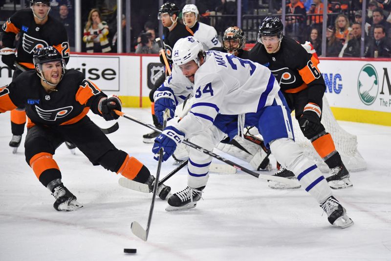 Mar 19, 2024; Philadelphia, Pennsylvania, USA; Toronto Maple Leafs center Auston Matthews (34) passes the puck while being defended by Philadelphia Flyers right wing Tyson Foerster (71) during the second period at Wells Fargo Center. Mandatory Credit: Eric Hartline-USA TODAY Sports