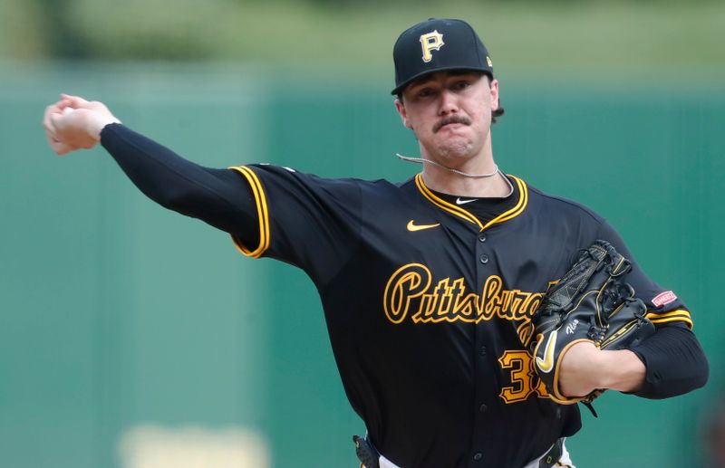 Jul 23, 2024; Pittsburgh, Pennsylvania, USA;  Pittsburgh Pirates starting pitcher Paul Skenes (30) delivers a pitch against the St. Louis Cardinals during the first inning at PNC Park. Mandatory Credit: Charles LeClaire-USA TODAY Sports