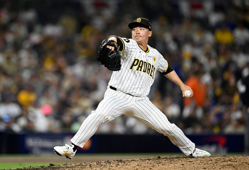 Oct 9, 2024; San Diego, California, USA; San Diego Padres pitcher Yuki Matsui (1) throws in the ninth inning against the Los Angeles Dodgers during game four of the NLDS for the 2024 MLB Playoffs at Petco Park.  Mandatory Credit: Denis Poroy-Imagn Images
