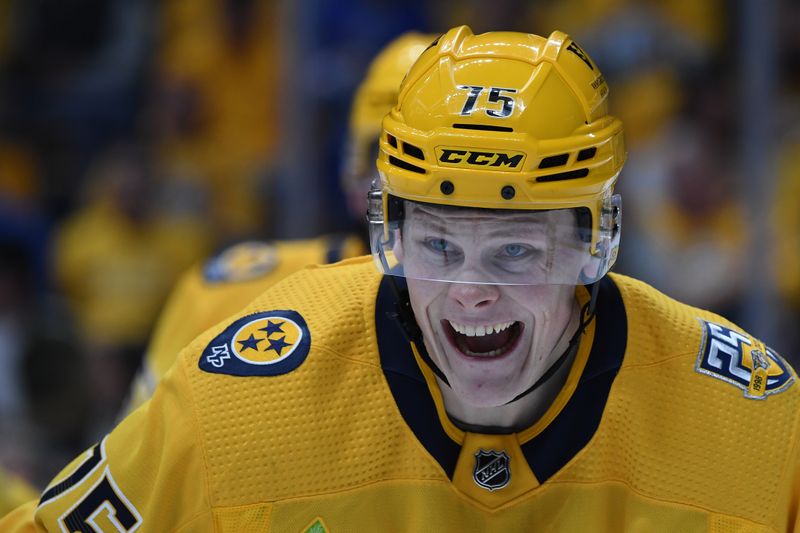 Dec 2, 2023; Nashville, Tennessee, USA; Nashville Predators center Juuso Parssinen (75) yells to another player before a face off against the New York Rangers during the second period at Bridgestone Arena. Mandatory Credit: Christopher Hanewinckel-USA TODAY Sports