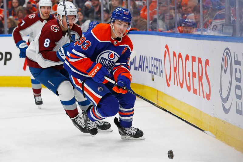 Mar 16, 2024; Edmonton, Alberta, CAN; Edmonton Oilers forward Ryan Nugent-Hopkins (93) and Colorado Avalanche defensemen Cale Makar (8) chase a loose puck during the third period at Rogers Place. Mandatory Credit: Perry Nelson-USA TODAY Sports