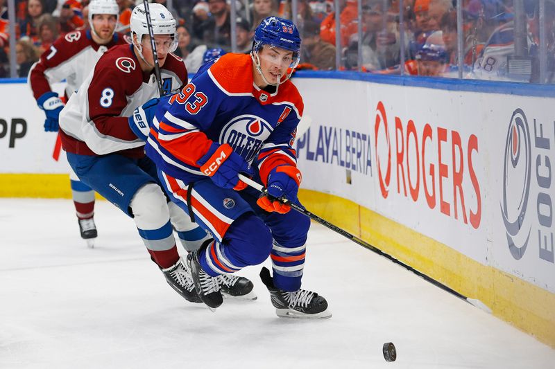 Mar 16, 2024; Edmonton, Alberta, CAN; Edmonton Oilers forward Ryan Nugent-Hopkins (93) and Colorado Avalanche defensemen Cale Makar (8) chase a loose puck during the third period at Rogers Place. Mandatory Credit: Perry Nelson-USA TODAY Sports