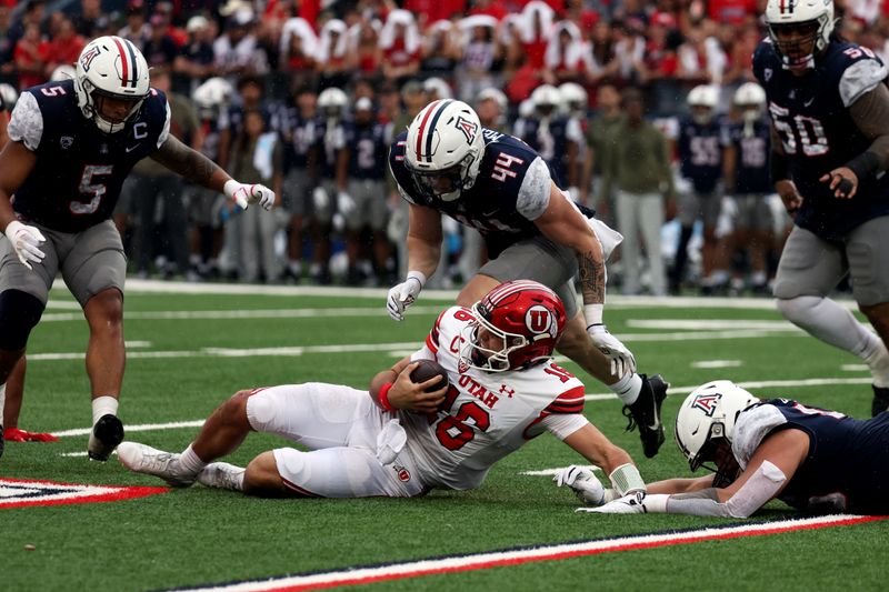 Nov 18, 2023; Tucson, Arizona, USA; Utah Utes quarterback Bryson Barnes (16) slides against Arizona Wildcats linebacker Jeremy Mercier (44) during the first half at Arizona Stadium. Mandatory Credit: Zachary BonDurant-USA TODAY Sports