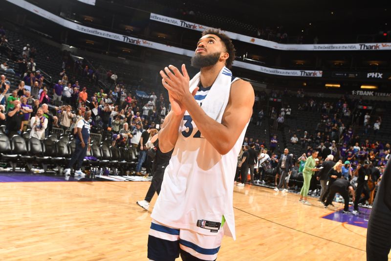 PHOENIX, AZ - APRIL 4: Karl-Anthony Towns #32 of the Minnesota Timberwolves looks on after the game against the Phoenix Suns during Round 1 Game 4 of the 2024 NBA Playoffs on April 4, 2023 at Footprint Center in Phoenix, Arizona. NOTE TO USER: User expressly acknowledges and agrees that, by downloading and or using this photograph, user is consenting to the terms and conditions of the Getty Images License Agreement. Mandatory Copyright Notice: Copyright 2024 NBAE (Photo by Barry Gossage/NBAE via Getty Images)