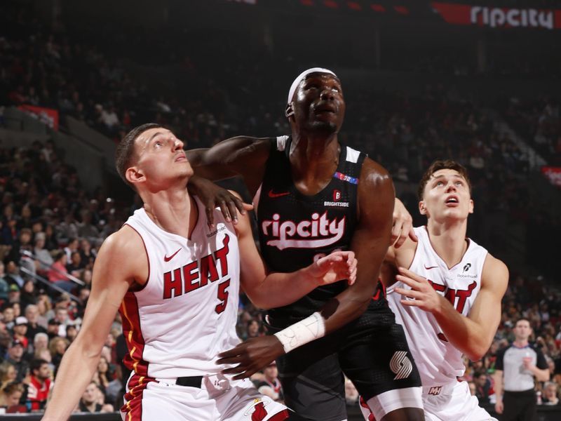 PORTLAND, OR - JANUARY 11:  Nikola Jovic #5 of the Miami Heat and Taze Moore #76 of the Portland Trail Blazers boxes out during the game on January 11, 2025 at the Moda Center Arena in Portland, Oregon. NOTE TO USER: User expressly acknowledges and agrees that, by downloading and or using this photograph, user is consenting to the terms and conditions of the Getty Images License Agreement. Mandatory Copyright Notice: Copyright 2025 NBAE (Photo by Cameron Browne/NBAE via Getty Images)