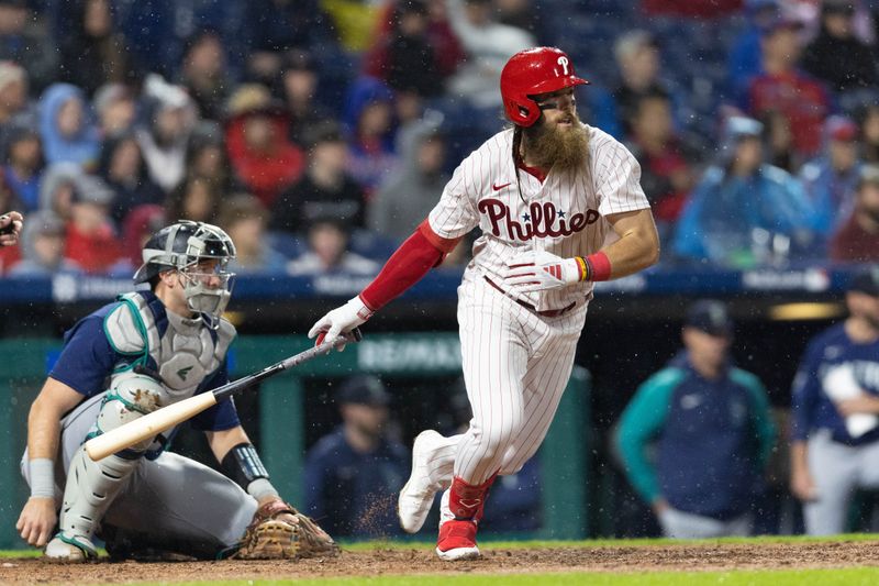 Apr 26, 2023; Philadelphia, Pennsylvania, USA; Philadelphia Phillies center fielder Brandon Marsh (16) hits a single during the eighth inning against the Seattle Mariners at Citizens Bank Park. Mandatory Credit: Bill Streicher-USA TODAY Sports