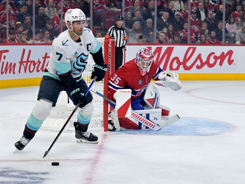 Oct 14, 2025; Montreal, Quebec, CAN; Seattle Kraken forward Jordan Eberle (7) plays the puck behind the net of Montreal Canadiens goalie Sam Montembeault (35) during the first period at the Bell Centre. Mandatory Credit: Eric Bolte-Imagn Images