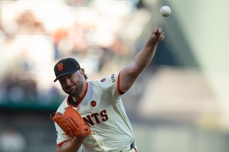 Aug 14, 2024; San Francisco, California, USA; San Francisco Giants starting pitcher Robbie Ray (23) delivers a pitch against the Atlanta Braves during the first inning at Oracle Park. Mandatory Credit: D. Ross Cameron-USA TODAY Sports