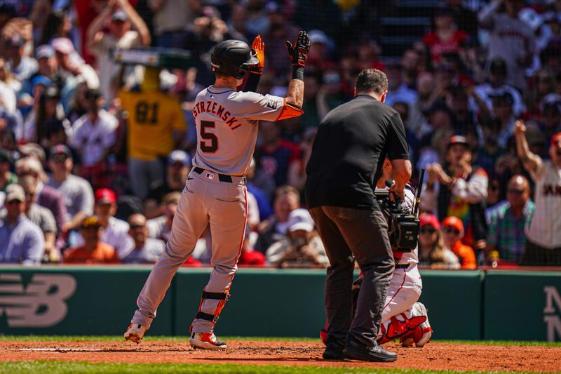 May 2, 2024; Boston, Massachusetts, USA; San Francisco Giants right fielder Mike Yastrzemski (5) hits a home run against the Boston Red Sox in the third inning at Fenway Park. Mandatory Credit: David Butler II-USA TODAY Sports