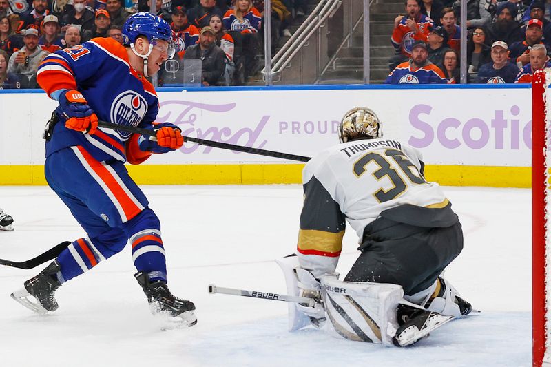 Nov 28, 2023; Edmonton, Alberta, CAN; Vegas Golden Knights goaltender Logan Thompson (36) makes a save on Edmonton Oilers forward Adam Erne (21) during the third period at Rogers Place. Mandatory Credit: Perry Nelson-USA TODAY Sports