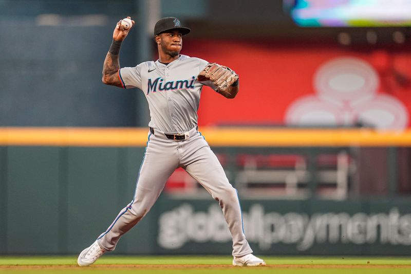 Apr 23, 2024; Cumberland, Georgia, USA; Miami Marlins shortstop Tim Anderson (7) throws for an out against the Atlanta Braves during the third inning at Truist Park. Mandatory Credit: Dale Zanine-USA TODAY Sports