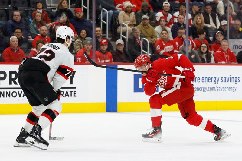 Jan 7, 2025; Detroit, Michigan, USA; Detroit Red Wings left wing Lucas Raymond (23) takes a shot in the second period against the Ottawa Senators at Little Caesars Arena. Mandatory Credit: Rick Osentoski-Imagn Images