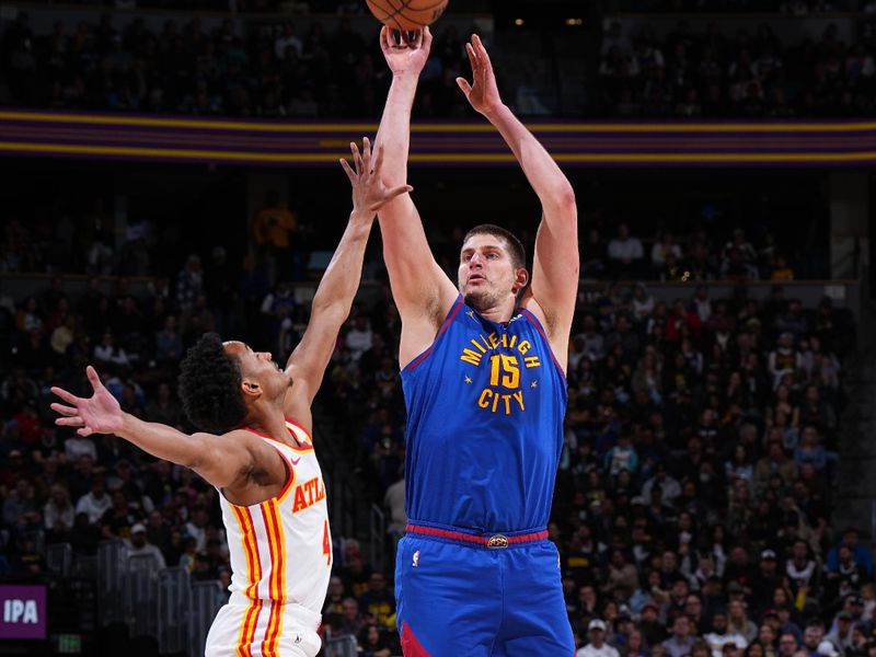 DENVER, CO - APRIL 6: Nikola Jokic #15 of the Denver Nuggets shoots the ball during the game against the Atlanta Hawks on April 6, 2024 at the Ball Arena in Denver, Colorado. NOTE TO USER: User expressly acknowledges and agrees that, by downloading and/or using this Photograph, user is consenting to the terms and conditions of the Getty Images License Agreement. Mandatory Copyright Notice: Copyright 2024 NBAE (Photo by Garrett Ellwood/NBAE via Getty Images)