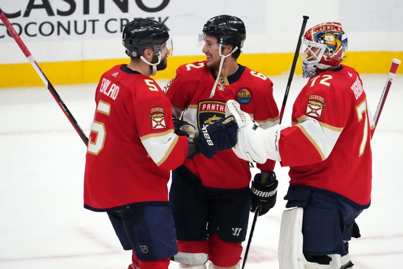 Dec 13, 2022; Sunrise, Florida, USA; Florida Panthers defenseman Aaron Ekblad (5) celebrates with defenseman Brandon Montour (62) and goaltender Sergei Bobrovsky (72) after defeating the Columbus Blue Jackets at FLA Live Arena. Mandatory Credit: Jasen Vinlove-USA TODAY Sports