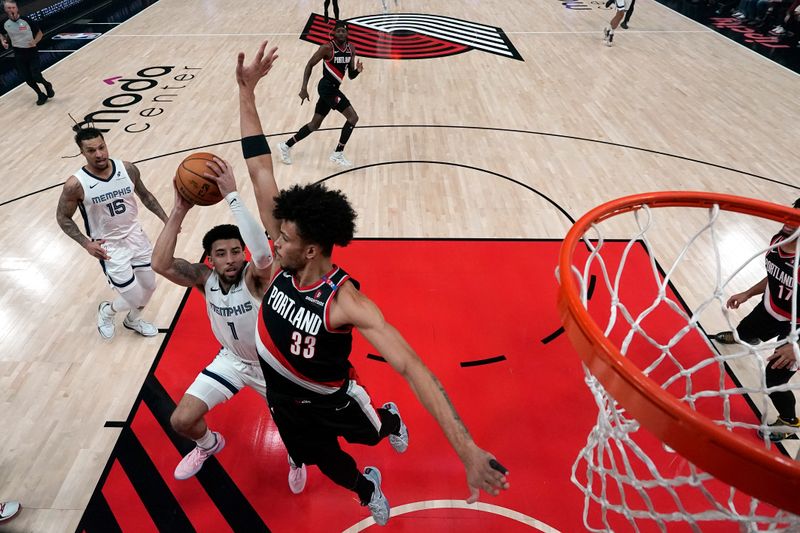 PORTLAND, OREGON - NOVEMBER 10: Scotty Pippen Jr. #1 of the Memphis Grizzlies shoots the ball over Toumani Camara #33 of the Portland Trail Blazers during the first half at Moda Center on November 10, 2024 in Portland, Oregon. NOTE TO USER: User expressly acknowledges and agrees that, by downloading and or using this photograph, User is consenting to the terms and conditions of the Getty Images License Agreement. (Photo by Soobum Im/Getty Images)