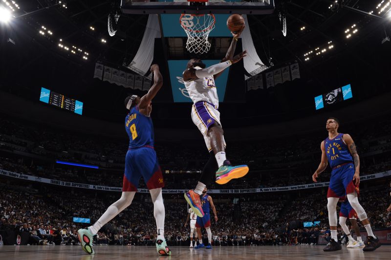 DENVER, CO - APRIL 20: LeBron James #23 of the Los Angeles Lakers drives to the basket during the game against the Denver Nuggets during Round 1 Game 1 of the 2024 NBA Playoffs on April 20, 2024 at the Ball Arena in Denver, Colorado. NOTE TO USER: User expressly acknowledges and agrees that, by downloading and/or using this Photograph, user is consenting to the terms and conditions of the Getty Images License Agreement. Mandatory Copyright Notice: Copyright 2024 NBAE (Photo by Garrett Ellwood/NBAE via Getty Images)