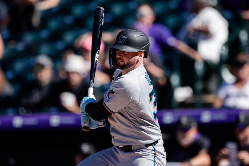 Sep 18, 2025; Denver, Colorado, USA; Miami Marlins designated hitter Liam Hicks (34) watches his ball on a two RBI single in the seventh inning against the Colorado Rockies at Coors Field. Mandatory Credit: Isaiah J. Downing-Imagn Images