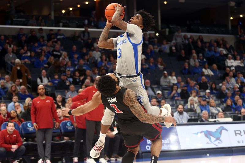 Feb 12, 2023; Memphis, Tennessee, USA; Memphis Tigers guard Kendric Davis (3) drives to the basket as Temple Owls guard Damian Dunn (1) defends during the first half at FedExForum. Mandatory Credit: Petre Thomas-USA TODAY Sports