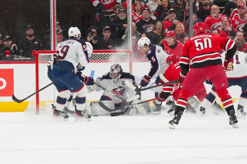 Dec 9, 2025; Raleigh, North Carolina, USA;  aCarolina Hurricanes left wing Taylor Hall (71) shot is stopped by Columbus Blue Jackets goaltender Jet Greaves (73) during the second period t Lenovo Center. Mandatory Credit: James Guillory-Imagn Images