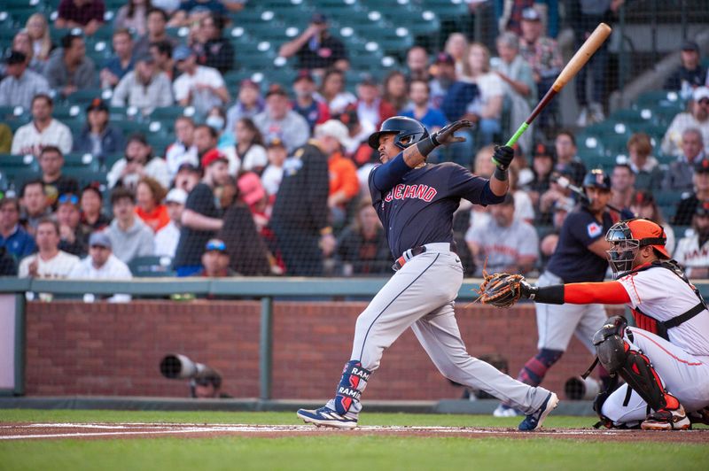 Sep 12, 2023; San Francisco, California, USA; Cleveland Guardians third baseman Jose Ramirez (11) hits a single during the first inning against the San Francisco Giants at Oracle Park. Mandatory Credit: Ed Szczepanski-USA TODAY Sports