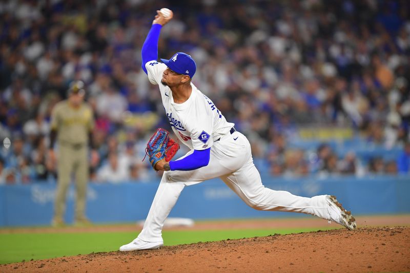 Sep 24, 2024; Los Angeles, California, USA; Los Angeles Dodgers pitcher Edgardo Henriquez (60) throws against the San Diego Padres during the sixth inning in his major league debut at Dodger Stadium. Mandatory Credit: Gary A. Vasquez-Imagn Images