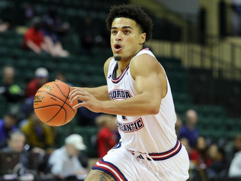 Nov 24, 2023; Kissimmee, FL, USA;  Florida Atlantic Owls guard Bryan Greenlee (4) drives to the hoop against the Texas A&M Aggies in the first half during the ESPN Events Invitational Semifinals at State Farm Field House. Mandatory Credit: Nathan Ray Seebeck-USA TODAY Sports