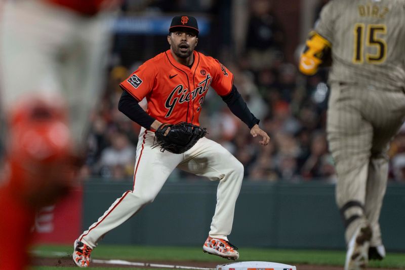 Sep 13, 2024; San Francisco, California, USA;  San Francisco Giants first base LaMonte Wade Jr. (31) reacts to the ball during the fourth inning against the San Diego Padres at Oracle Park. Mandatory Credit: Stan Szeto-Imagn Images