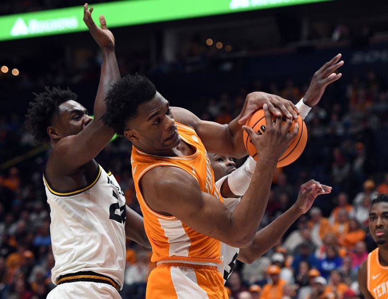 Mar 10, 2023; Nashville, TN, USA; Tennessee Volunteers forward Tobe Awaka (11) grabs a rebound against Missouri Tigers guard Kobe Brown (24) during the first half at Bridgestone Arena. Mandatory Credit: Christopher Hanewinckel-USA TODAY Sports